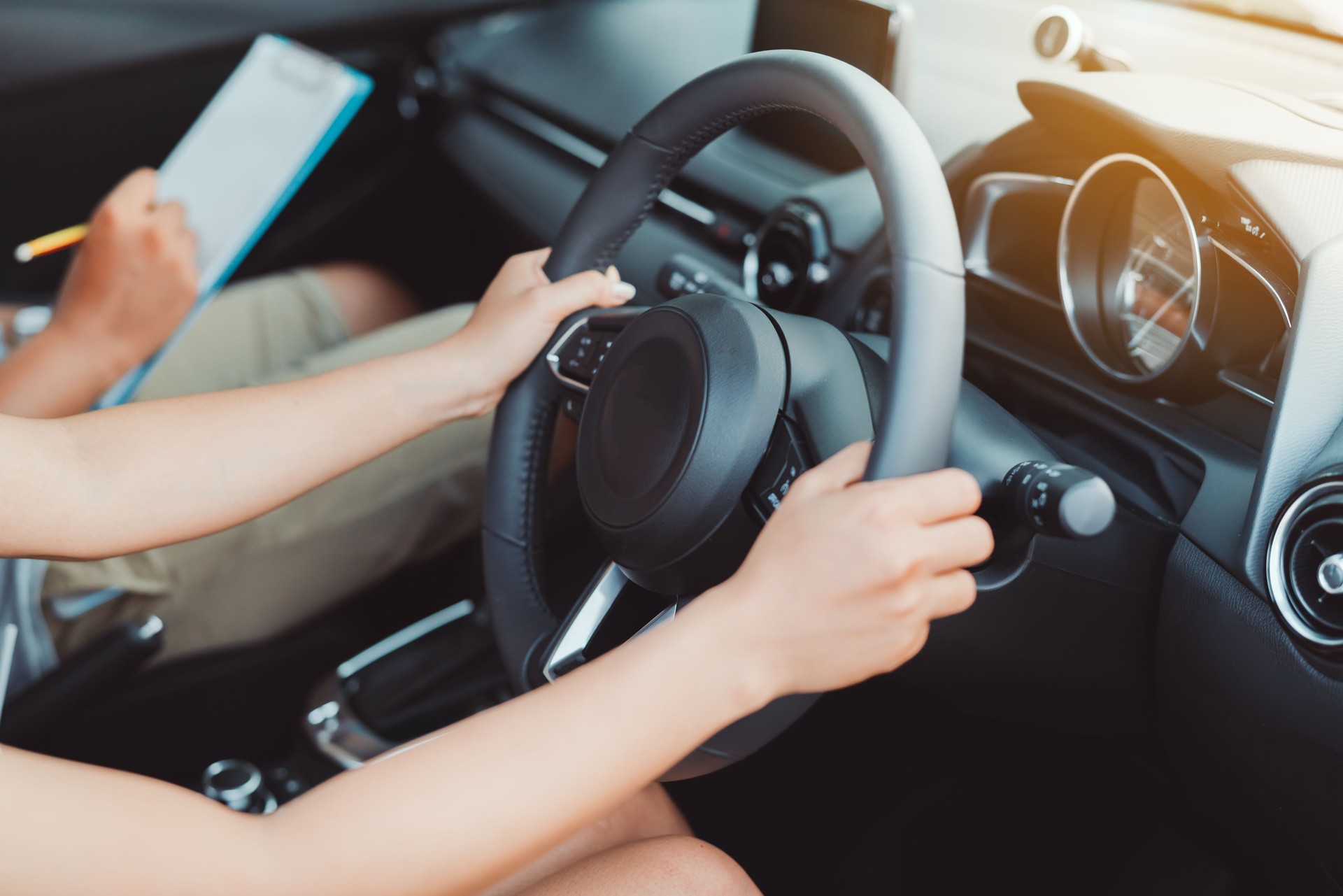 Woman practice driving car exam driver licence control steering wheel education and learn on street road by driving instructor teaching at school drive transportation safety travel, people lifestyle